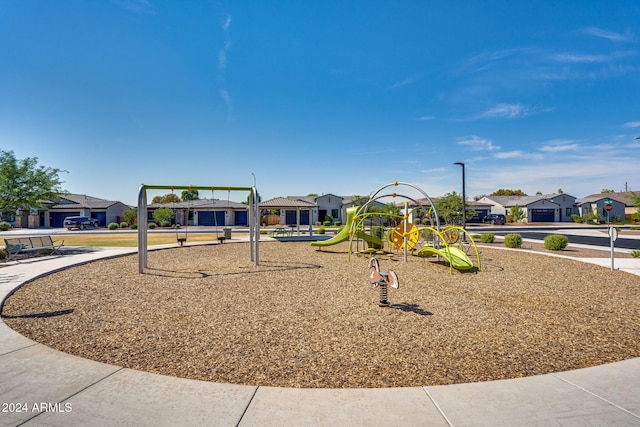 communal playground featuring a residential view