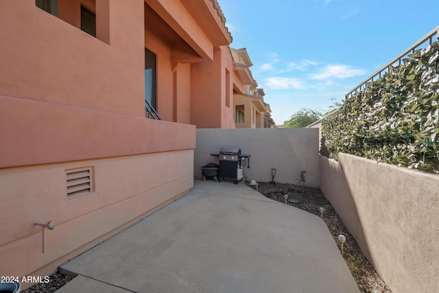 view of side of home featuring a patio area