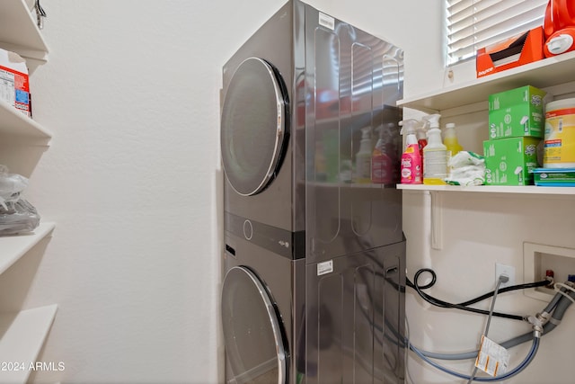 laundry room featuring stacked washer and dryer