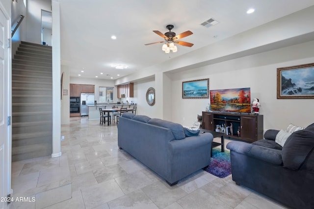 living room featuring ceiling fan