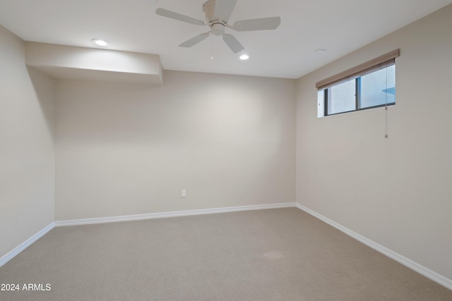 spare room with carpet flooring and ceiling fan