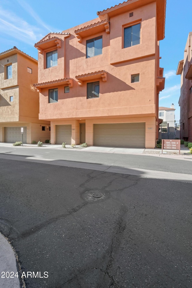 townhome / multi-family property featuring a garage