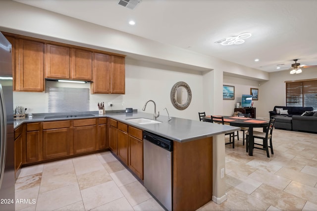 kitchen with dishwasher, ceiling fan, kitchen peninsula, and sink