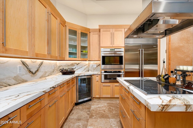 kitchen with light stone countertops, decorative backsplash, light brown cabinetry, stainless steel appliances, and wine cooler