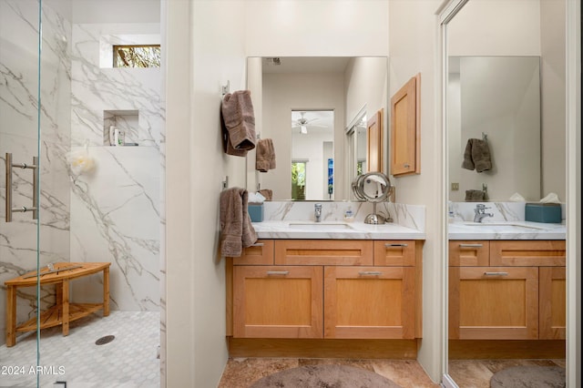 bathroom featuring a shower and vanity