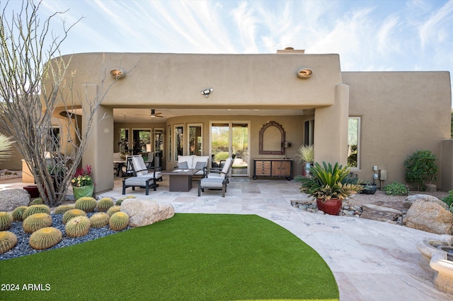 back of house with outdoor lounge area, a patio, and ceiling fan