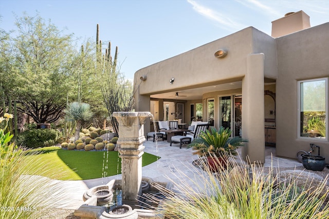 view of patio / terrace featuring an outdoor living space and ceiling fan