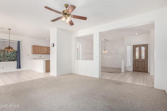 kitchen featuring light tile patterned floors, recessed lighting, light countertops, visible vents, and white appliances