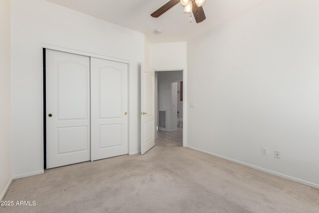 washroom featuring cabinet space, washing machine and dryer, and baseboards