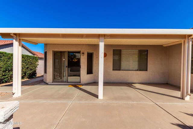 view of patio featuring outdoor dining area and fence