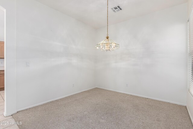 carpeted living room with visible vents and ceiling fan