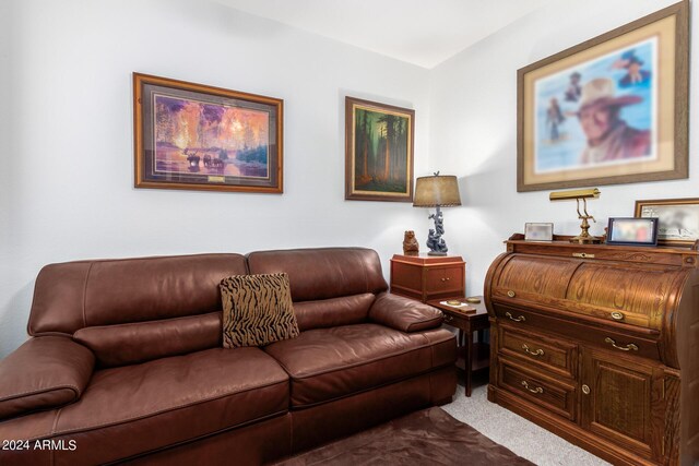 living area featuring visible vents, ceiling fan, and carpet flooring