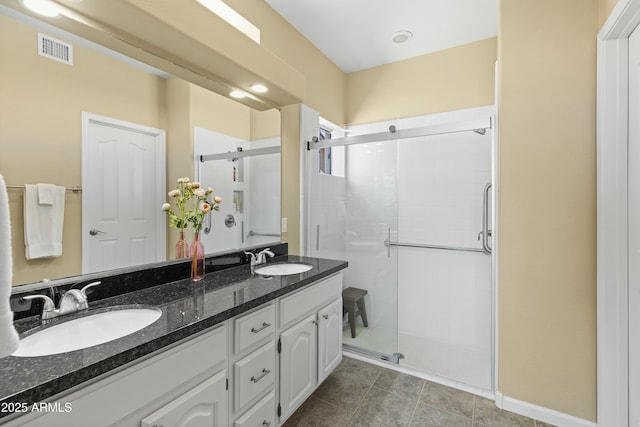 bathroom featuring vanity and an enclosed shower