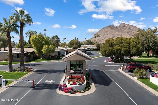 view of street featuring a gated entry and a mountain view