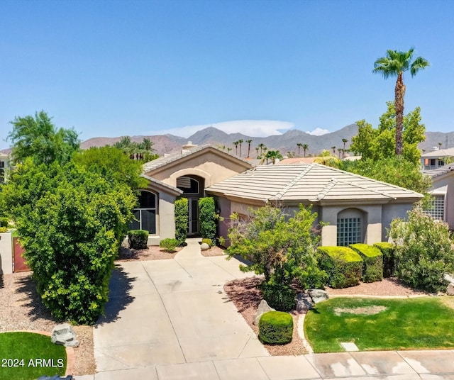 view of front of property with a mountain view