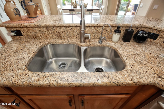 details featuring sink and light stone countertops