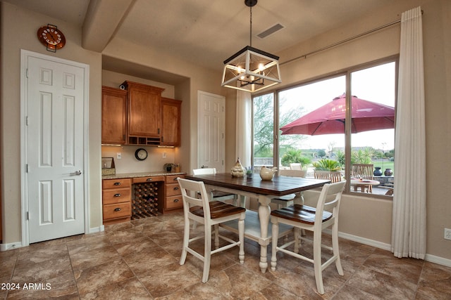 dining space featuring a chandelier