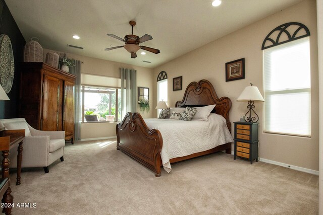 carpeted bedroom featuring ceiling fan