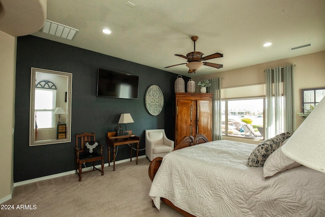 carpeted bedroom featuring ceiling fan