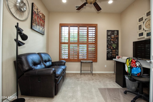 carpeted office space with ceiling fan