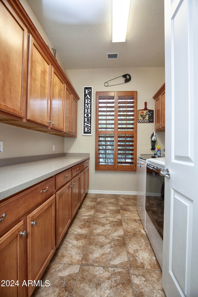 kitchen featuring separate washer and dryer