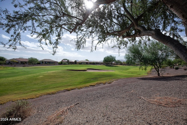 view of home's community featuring a lawn