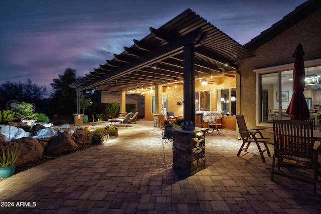 view of patio terrace at dusk