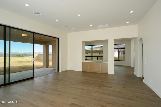 spare room featuring hardwood / wood-style flooring