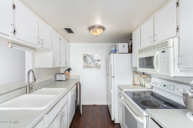 kitchen featuring white appliances, white cabinetry, sink, and dark hardwood / wood-style floors