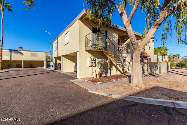 view of front of property with a carport