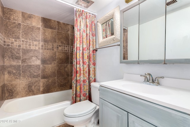 full bathroom with toilet, shower / bath combo with shower curtain, and vanity