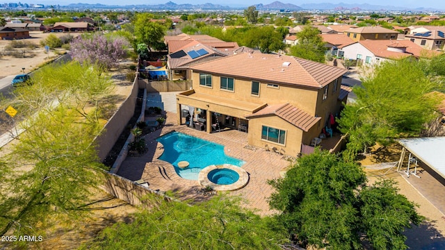 birds eye view of property with a residential view and a mountain view