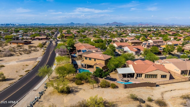 birds eye view of property featuring a mountain view and a residential view