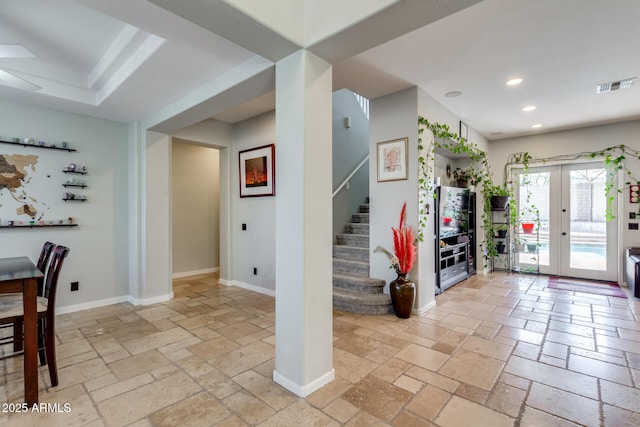 interior space featuring stairway, stone tile floors, visible vents, and recessed lighting