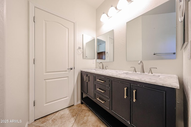bathroom featuring double vanity, a sink, and tile patterned flooring