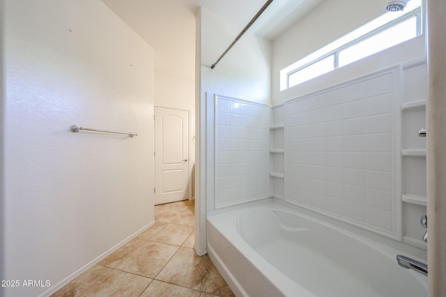 bathroom with baseboards, tile patterned flooring, and shower / tub combination