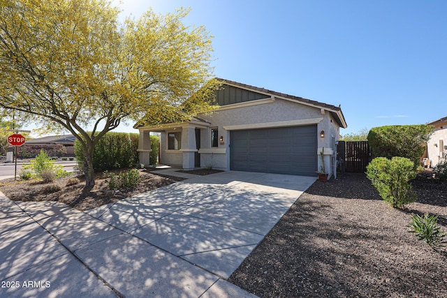 ranch-style house featuring stucco siding, fence, concrete driveway, and a garage