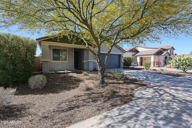 12679 W Lowden Rd, Peoria, AZ 85383 - view of front of home with driveway, stucco siding, and a garage