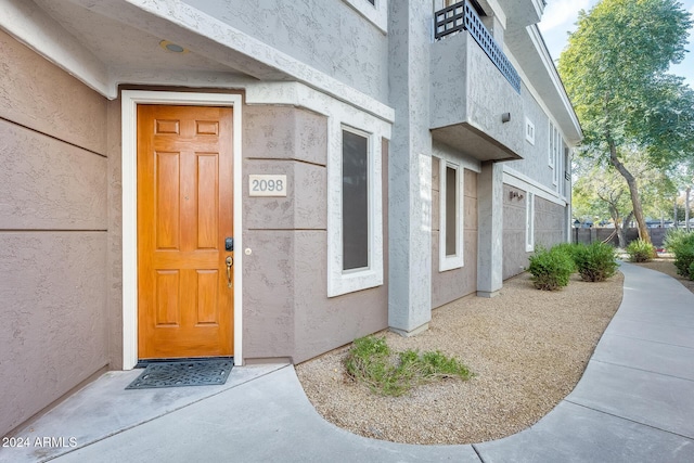 view of exterior entry featuring a garage