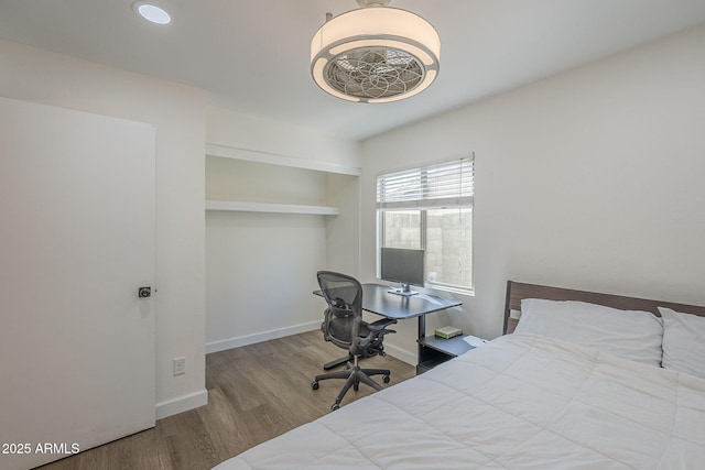 12234 S Pewaukee St, Phoenix, AZ 85044 - bedroom featuring wood finished floors and baseboards