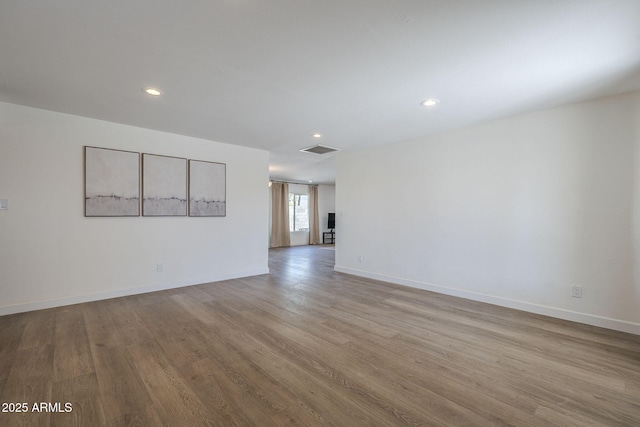 12234 S Pewaukee St, Phoenix, AZ 85044 - spare room with wood finished floors and recessed lighting