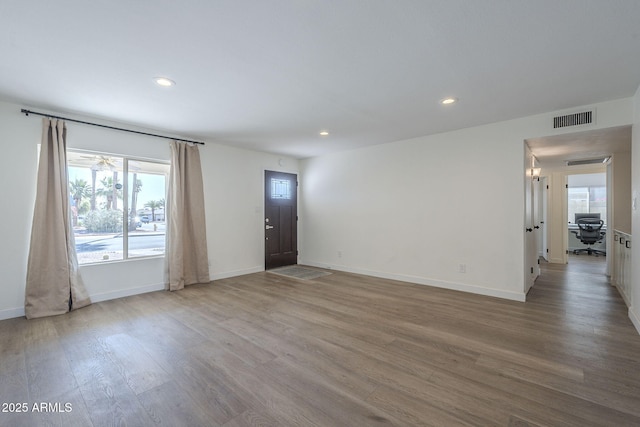 12234 S Pewaukee St, Phoenix, AZ 85044 - unfurnished room with wood finished floors and recessed lighting