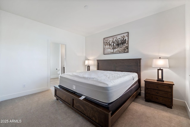 bedroom featuring carpet flooring and baseboards