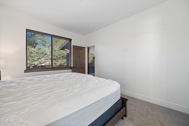 carpeted bedroom with baseboards