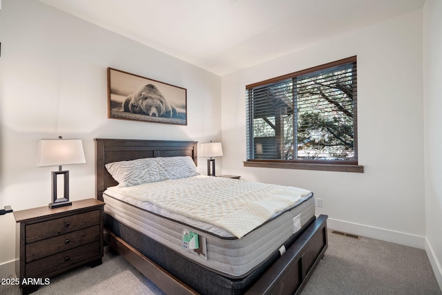 bedroom with light colored carpet, visible vents, and baseboards