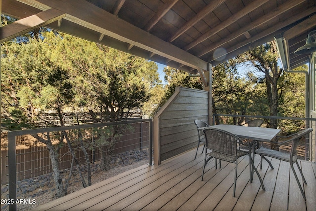 wooden terrace with outdoor dining area