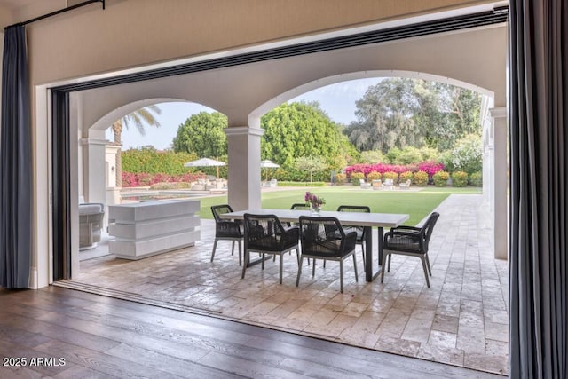 view of patio featuring outdoor dining area
