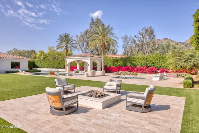 view of patio with an outdoor pool, a gazebo, an outdoor living space with a fire pit, and a mountain view
