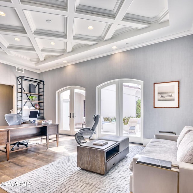 living area featuring recessed lighting, arched walkways, coffered ceiling, and french doors