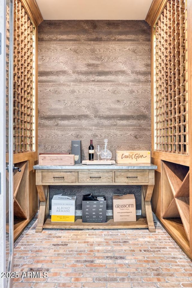 wine cellar with wood walls and brick floor